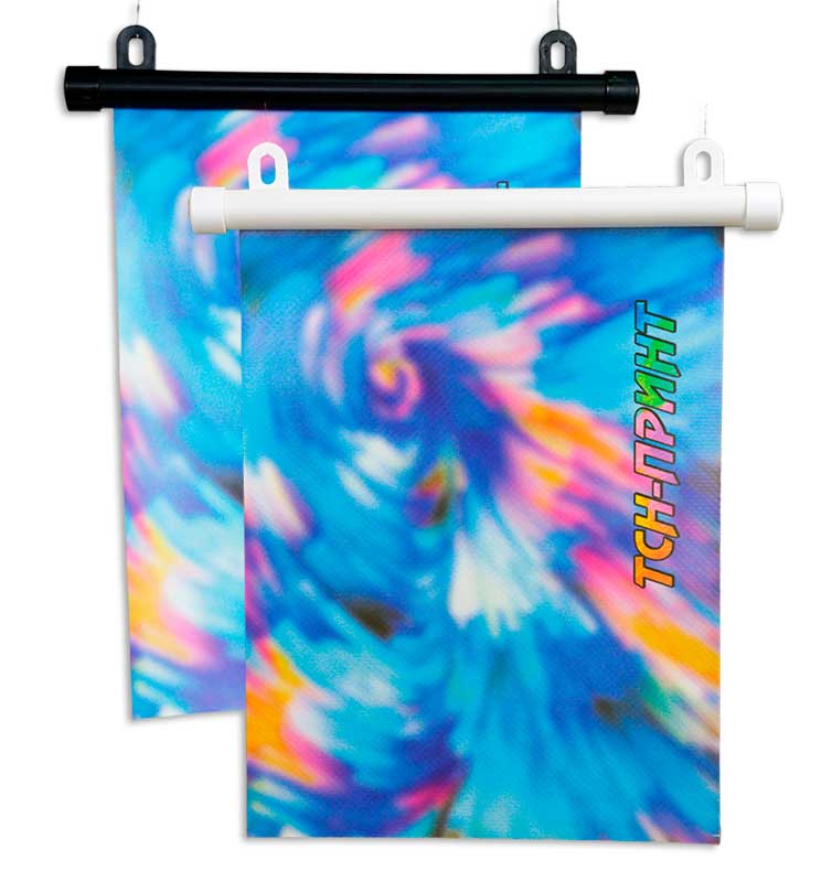 Вид подвески баннера из ткани на круглом, белом и черном, пластиковом профиле, 18 мм., с ушками